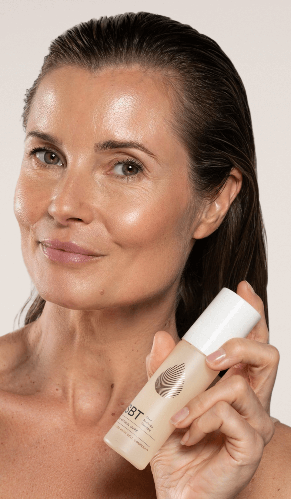 SBT The Retinol Cure women with product in hand